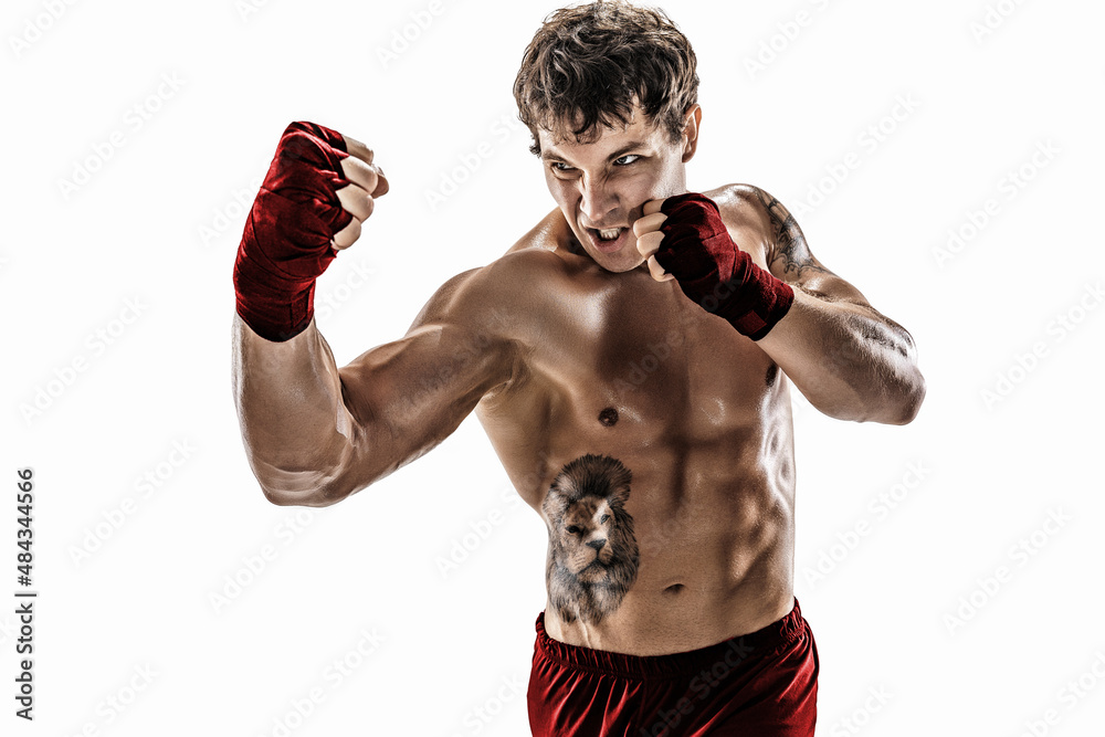 Portrait of aggressive boxer who training, practicing uppercut on white background. Red sportswear - obrazy, fototapety, plakaty 