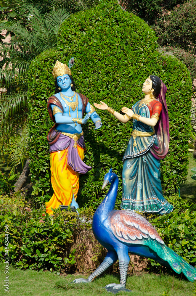 Radha and Krishna idols in different poses in garden of Nilkanthdham, Swaminarayan temple, Poicha, Gujarat,