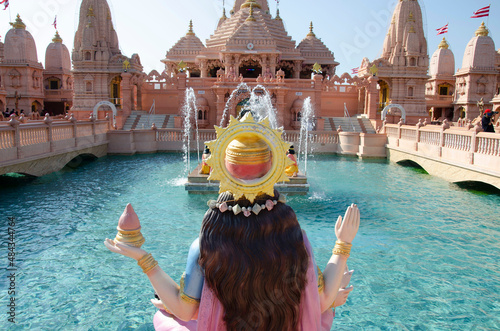 Goddess Narmada overseeing the Neelkanth Sarovar, artificial pond and Sandstone mandaps, Neelkanth Dham Swaminarayan Temple, Poicha, Gujarat, India, located at Poicha, Gujarat, India photo