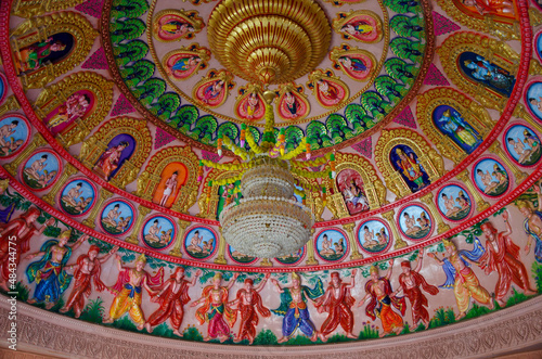 Interior ceiling of Swaminarayan temple with gods, deities and dancing figures carved on the same. Nilkanthdham, Poicha, Gujarat, India photo