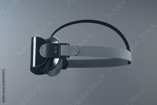 Close up of VR glasses on gray background. Virtual reality and digital entertainment concept. 3D Rendering.