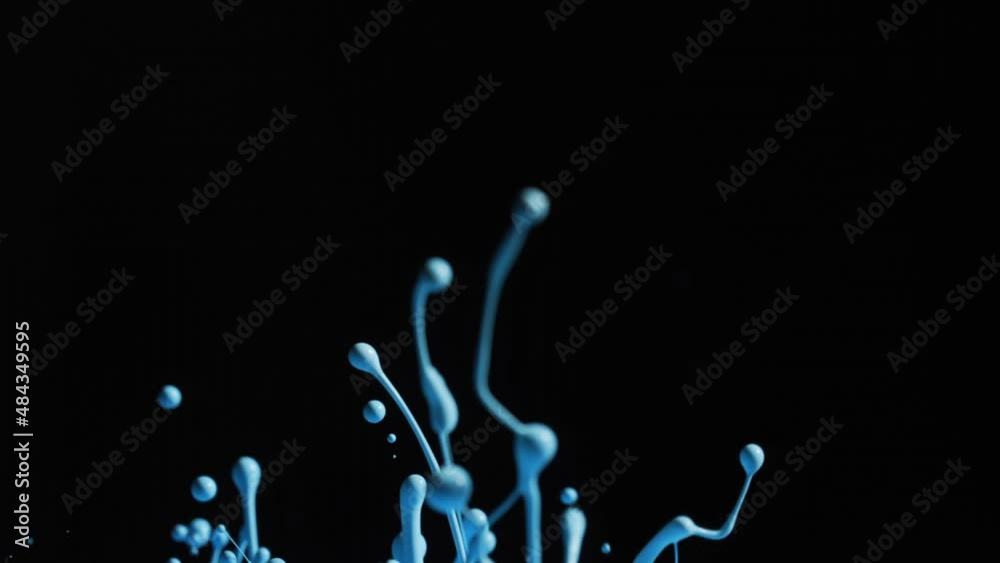 Bright Blue Paint Splashing With Droplets Into Air Bright Blue Paint Splashing With Droplets Into Air