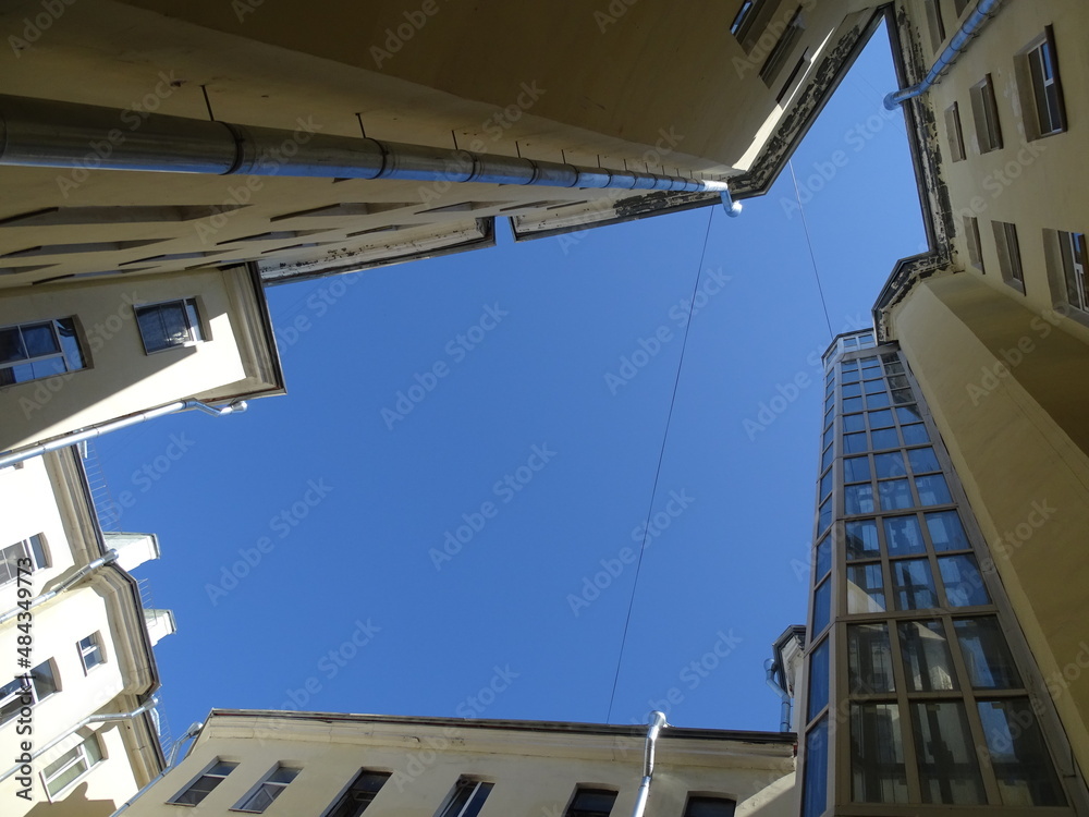 A typical Petersburg courtyard-well, a view of the sky, a complex geometric figure from the walls 