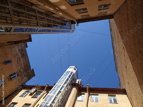 A typical Petersburg courtyard-well, a view of the sky, a complex geometric figure from the walls 