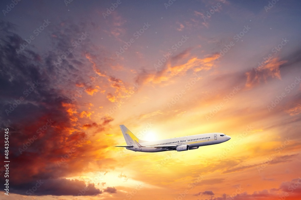 The plane takes off at sunset, air travel to the sky