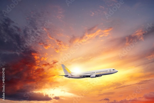 Obraz na płótnie The plane takes off at sunset, air travel to the sky w salonie