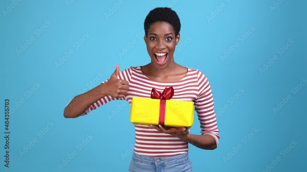 Bisexual lesbian person approve thumb-up package isolated blue color background Bisexual lesbian person approve thumb-up package isolated blue color background