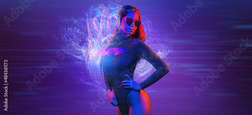 Fashionable glamour beautiful woman with Trendy wavy neon light hairstyle. Party night club vibes, gel filter. Excited shapely sexy girl. Bright pink blue lighting. Art fashion creative neon color. © Igor Link
