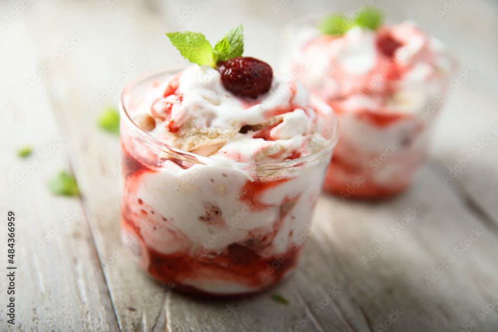 Homemade meringue dessert with raspberry and cream