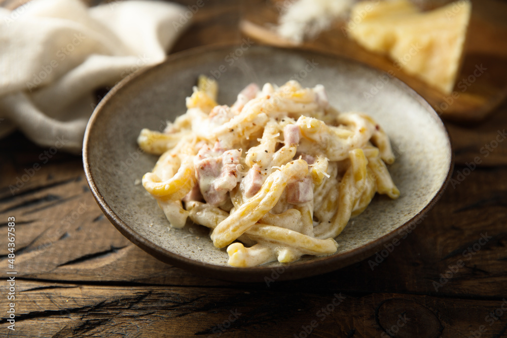 Traditional homemade pasta Carbonara with cheese and ham