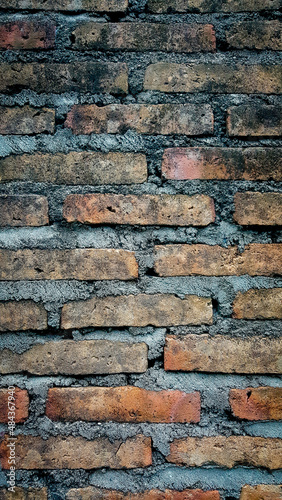Old brick wall background  brick wall texture  structure. old broken brick  cement joints  close-up. crumbling from old age. construction  repair. concept of devastation  decline. Abstract Web Banner