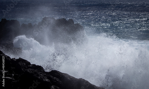 dramatic great wave crushing on the rocks 