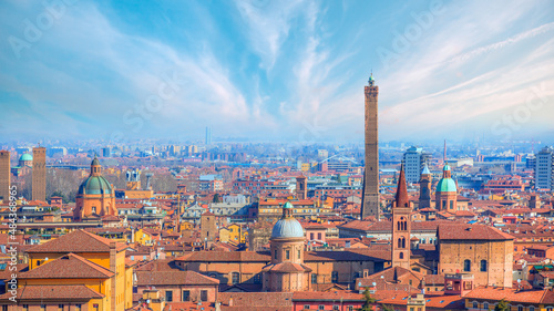 Fototapeta Naklejka Na Ścianę i Meble -  Panoramic view of red rooftops and buildings - Cityscape from above, view of Garisenda and Asinelli tower - Bologna, Italy