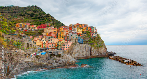 Manarola town, Cinque Terre Italy at the Ligurian Sea - Five famous colorful villages of Cinque Terre - Colorful cityscape on the mountains over Mediterranean sea 