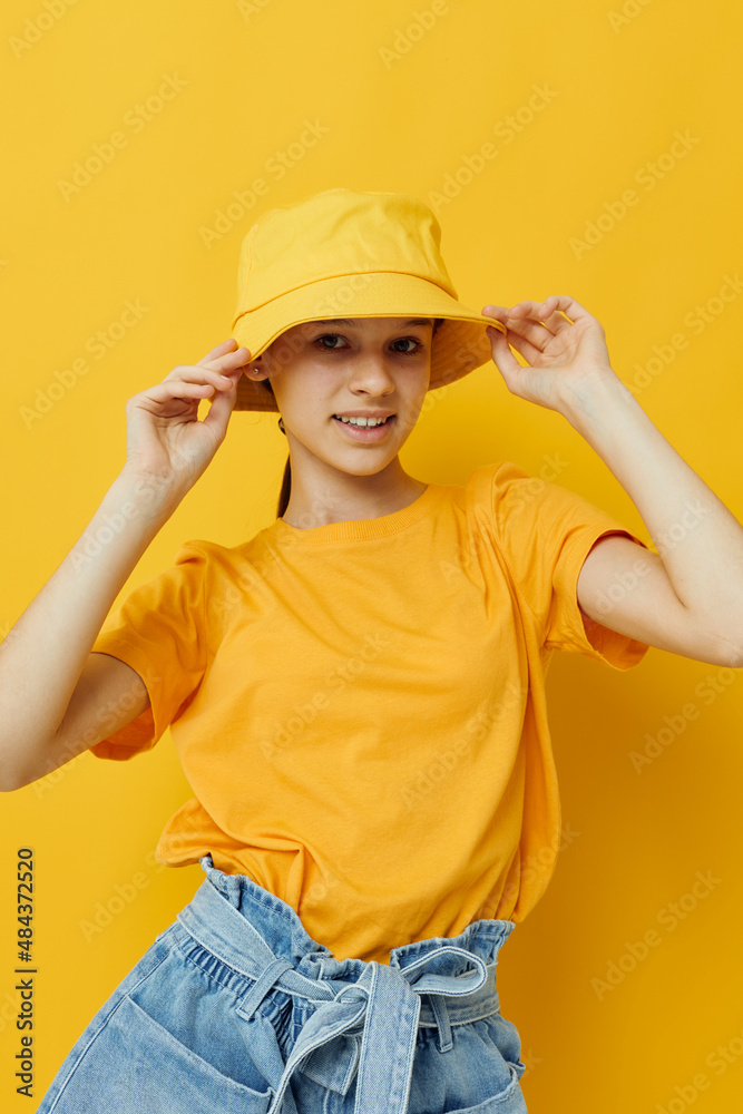 attractive woman in a yellow hat Youth style casual wear yellow background attractive woman in a yellow hat Youth style casual wear yellow background