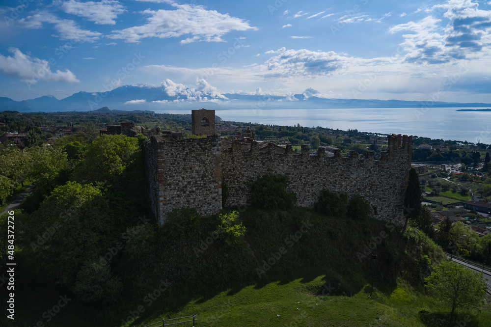 Aerial view of the historic part of Padenghe Castle on Lake Garda, Italy. Historic castles in Italy. Top view of the castle. Panorama of Lake Garda.