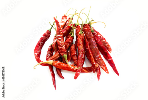 Isolated asian dry red chillies pepper on a white background	