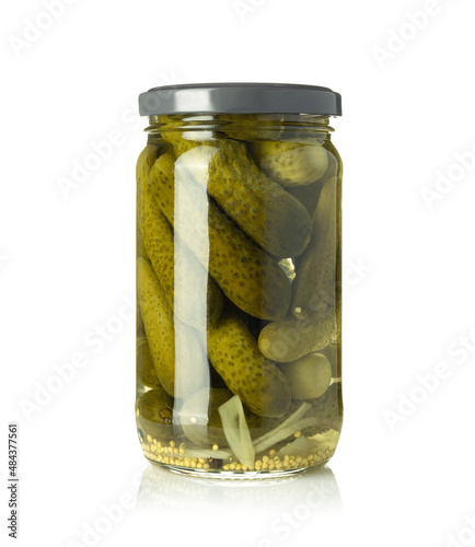 Pickled cucumbers isolated. Pickles in glass jar isolated on white background.