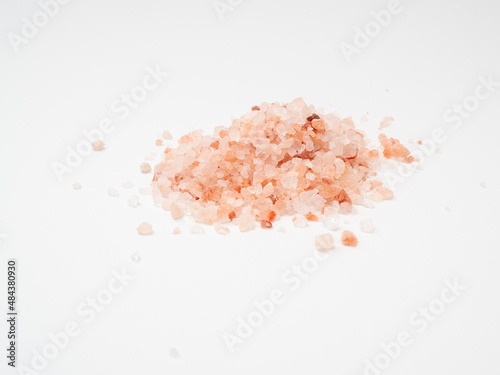 Pink salt on a white background.