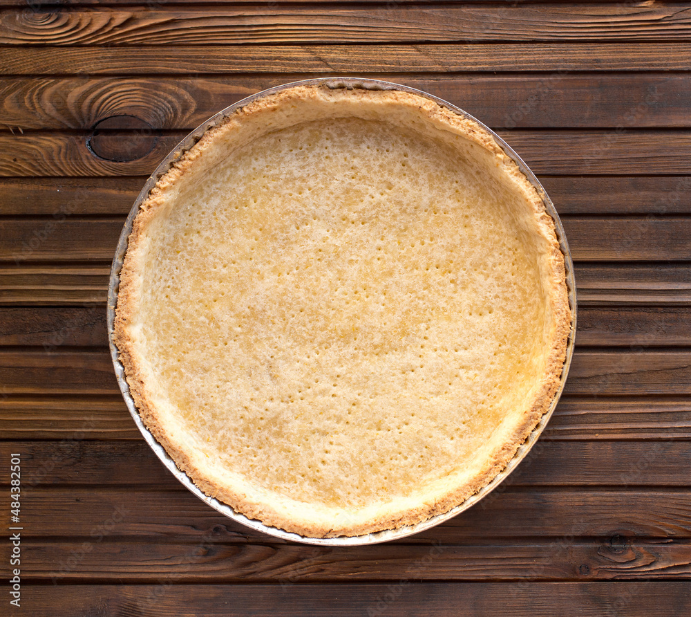 Pie blank - shortbread dough after baking, before filling with filling, in a round shape Pie blank - shortbread dough after baking, before filling with filling, in a round shape