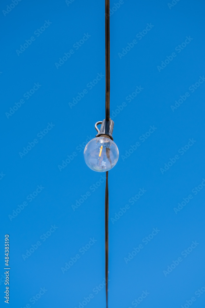 Illumination landscape light park with electric garland of light bulbs Illumination landscape light park with electric garland of light bulbs