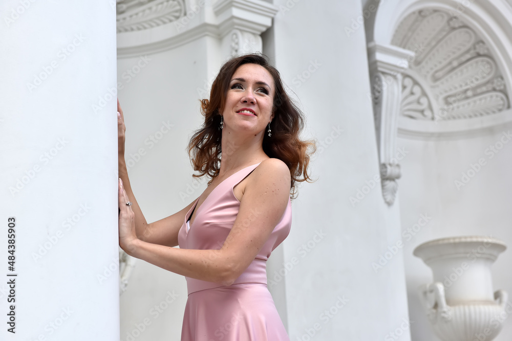 beautiful elegant brunette woman in pink dress beautiful elegant brunette woman in pink dress