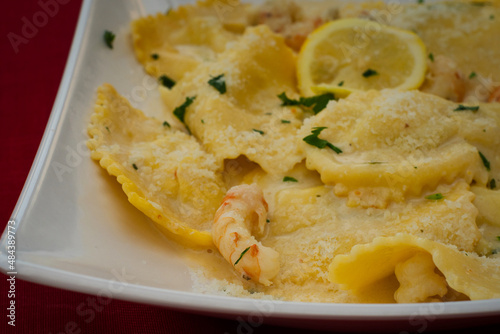 Delicious homemade ravioli filled with Adriatic sea trout and served under shrimp sauce