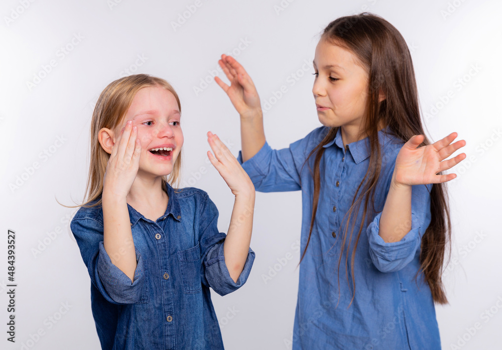 He cries with happiness. Girl consoling her crying friend by blowing ...