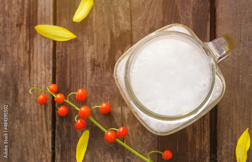 Beer with flower  in rustic style Top view background