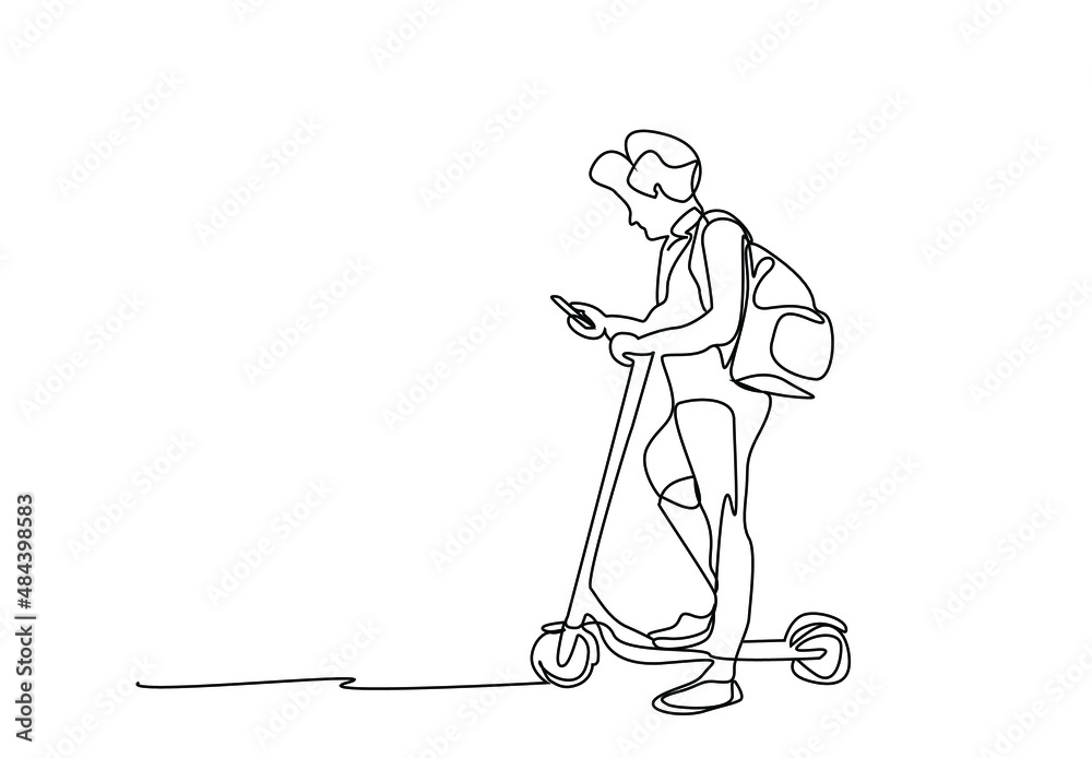 person using electric scooter in the city is standing looking at the phone in his hand