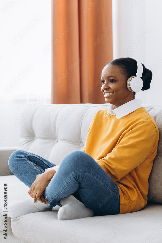 © anatoliycherkas - Rest And Relax Concept. Calm black woman sitting on bean bag, listening to music, audio book, podcast, enjoying meditation for sleep and peaceful mind in wireless headphones, leaning back, copy space © anatoliycherkas - Rest And Relax Concept. Calm black woman sitting on bean bag, listening to music, audio book, podcast, enjoying meditation for sleep and peaceful mind in wireless headphones, leaning back, copy space