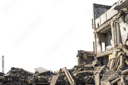 Canvas Print A large ruined building with a pile of construction debris and concrete debris isolated on a white background