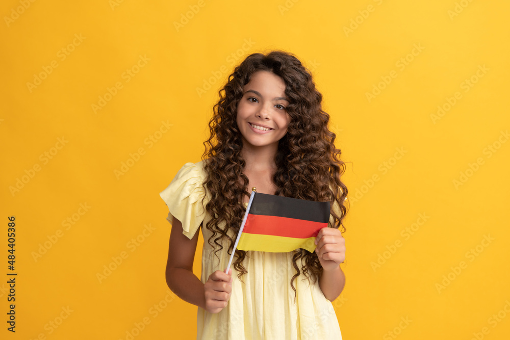 smiling kid long curly hair hold german flag, germany smiling kid long curly hair hold german flag, germany