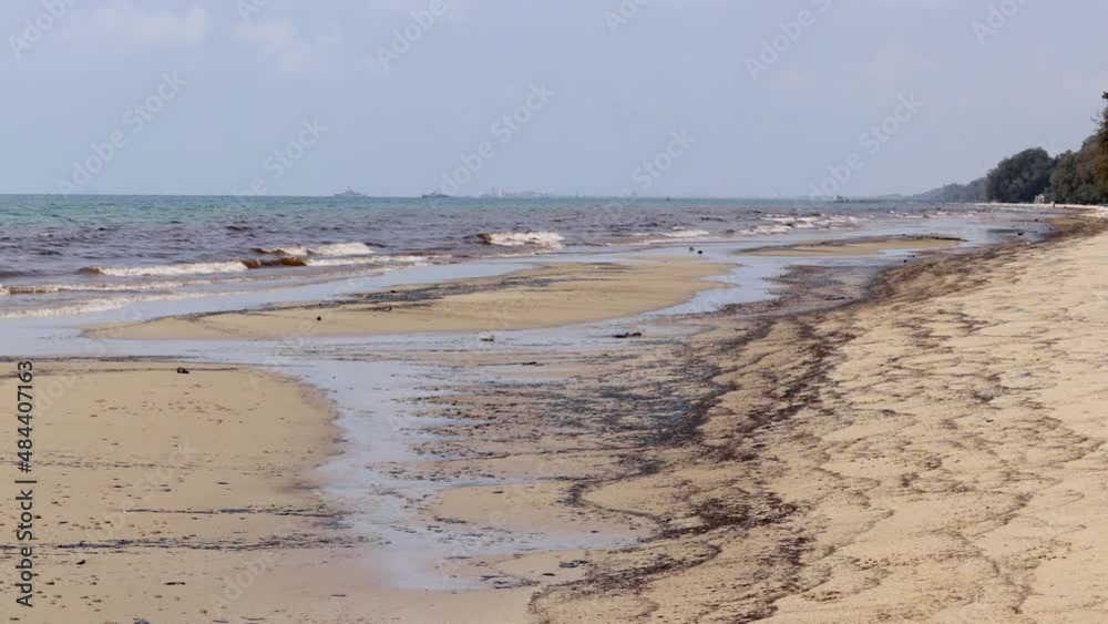 Oil Spill At Mae Ram Phueng Beach Leaked From An Underwater Pipeline In Rayong, Thailand. - wide static Oil Spill At Mae Ram Phueng Beach Leaked From An Underwater Pipeline In Rayong, Thailand. - wide static