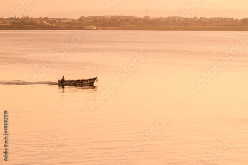 Fisherman and boat in harbor