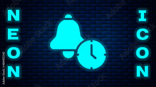 Glowing neon Alarm clock icon isolated on brick wall background. Wake up, get up concept. Time sign. Vector