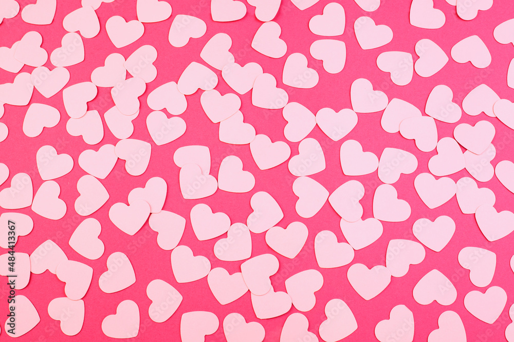 Hearts shaped made of paper on a pink background. Top view. Valentine's day or wedding. Love and romance concept.