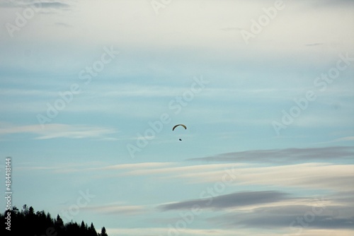 Paraglider enjoying a snowy sunset