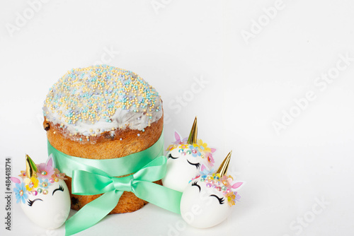 spring holiday. easter cake and white eggs unicorns