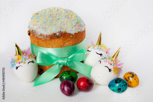 spring holiday. Easter cake and colorful brightly colored quail eggs and unicorn eggs