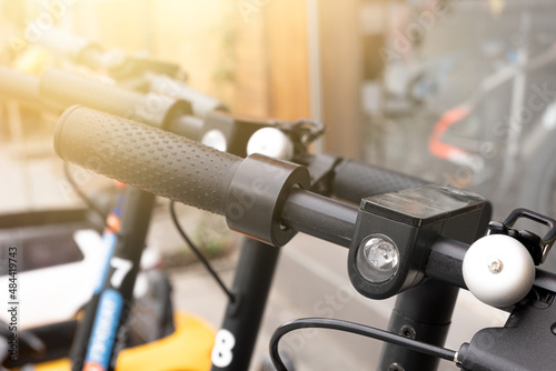 Steering wheel of rolling electric scooters close-up.