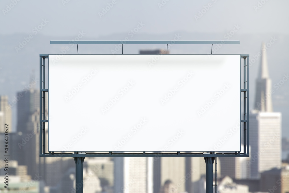 Obraz premium Blank white horizontal billboard on city buildings background at daytime, front view. Mockup, advertising concept