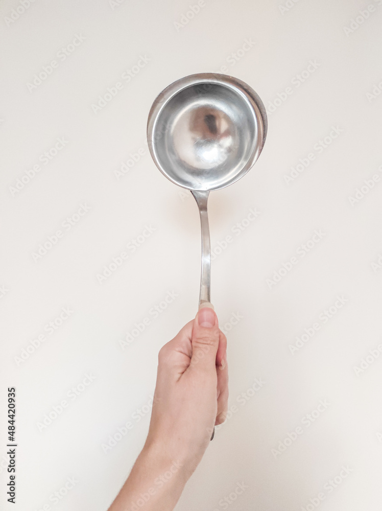 hand holding ladle