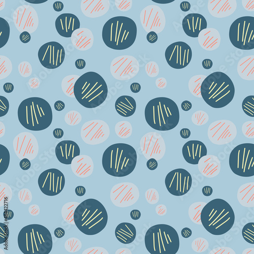 Circles seamless pattern on blue background. Hand drawn doodle style vector.