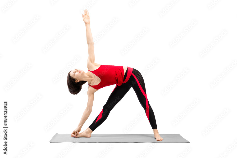 Yoga, triangle pose. Attractive fit woman in red sportswear with haircut practice Utthita Trikonasana drill, isolated on white.