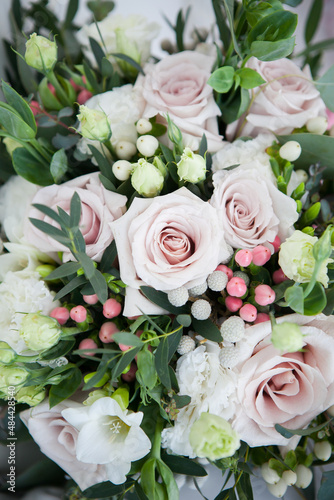 bridal bouquet in boho, rustic style. bouquet of soft pink roses, eustomas and eucalyptus branches