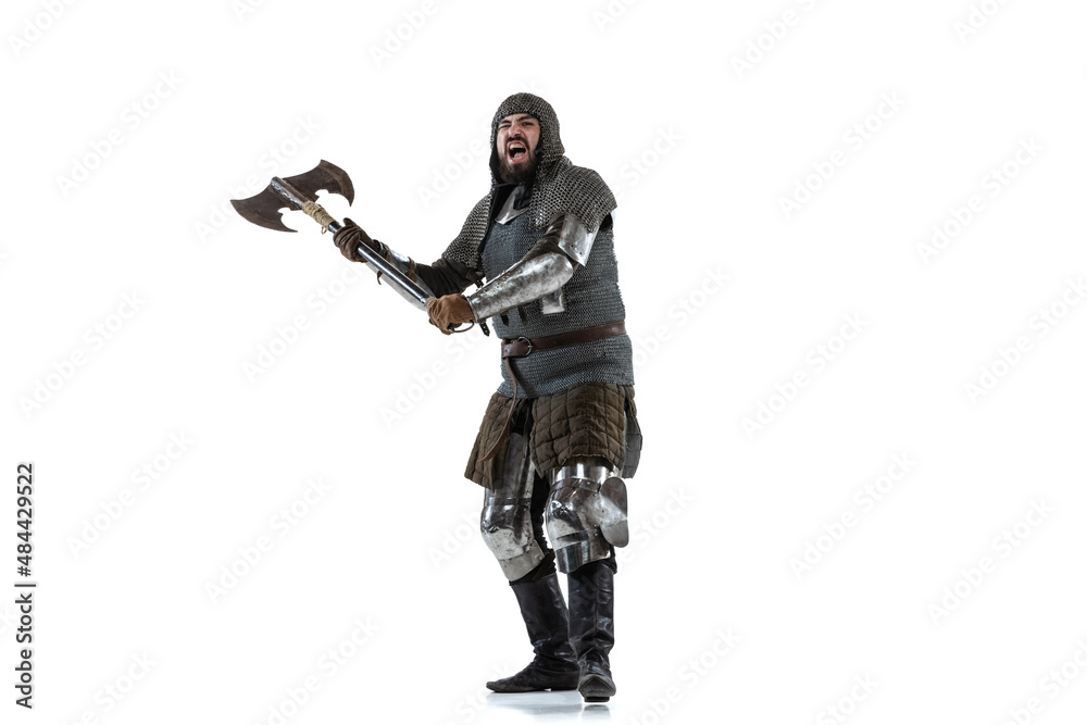 Portrait of brutal brave man in costume of medieval warrior, knight posing isolated over white studio background Portrait of brutal brave man in costume of medieval warrior, knight posing isolated over white studio background