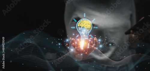 woman holding Light bulbs with Brain and gears inside and Low poly wireframe outside and connection line Creative and innovation inspiration. Business Bright idea concept.