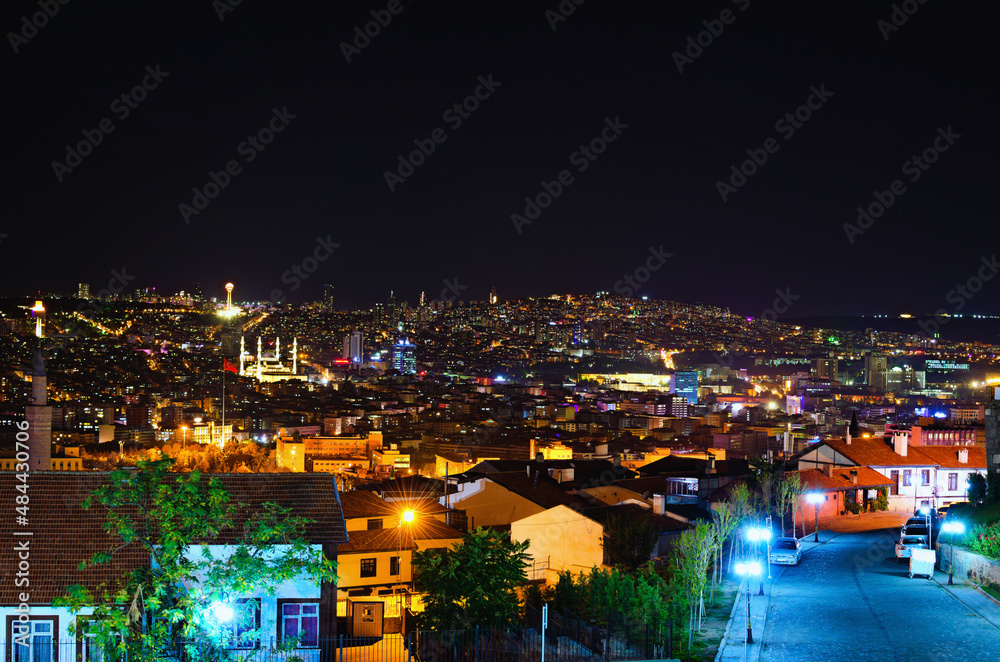 Picturesque aerial night light landscape view of Ankara. Illuminated high-rise buildings on the horizon. View from the hill near Ankara Castle. Travel and tourism concept