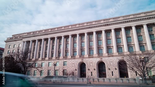 The IRS Building, headquarters of the Internal Revenue Service, in Washington, D.C. seen from Constitution Avenue NW during a winter day in a time-lapse. The wide-angle camera view pans rightward. photo